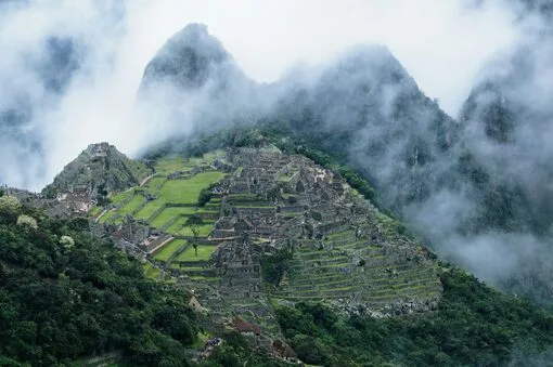 Misty morning view of Machu Picchu in the Andes Mountains.